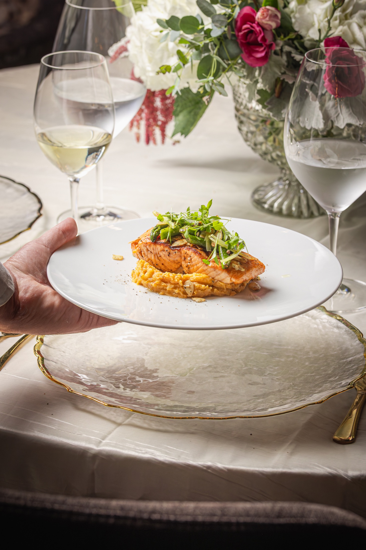 A beautifully plated salmon course ready for a guest