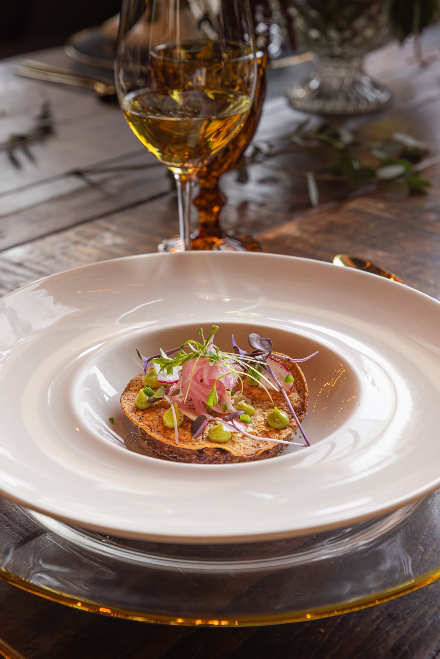 Tostada course with avocado and pickled vegetables